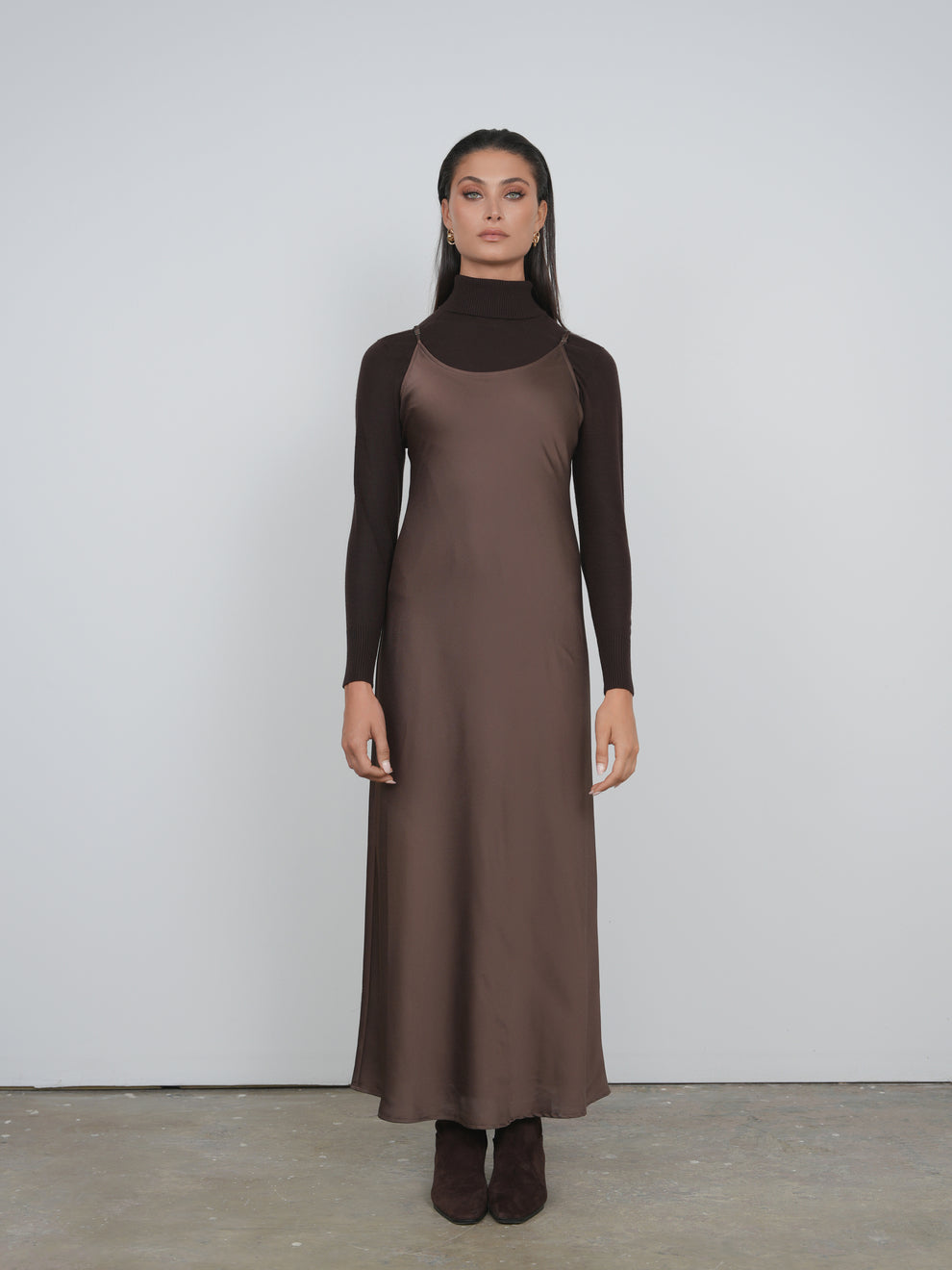 satin brown slip dress Theres something about a chocolate brown slip dress that makes date night dressing feel effortless. The satin fabric has that luxurious sheen that instantly elevates your lookelegant, soft, and